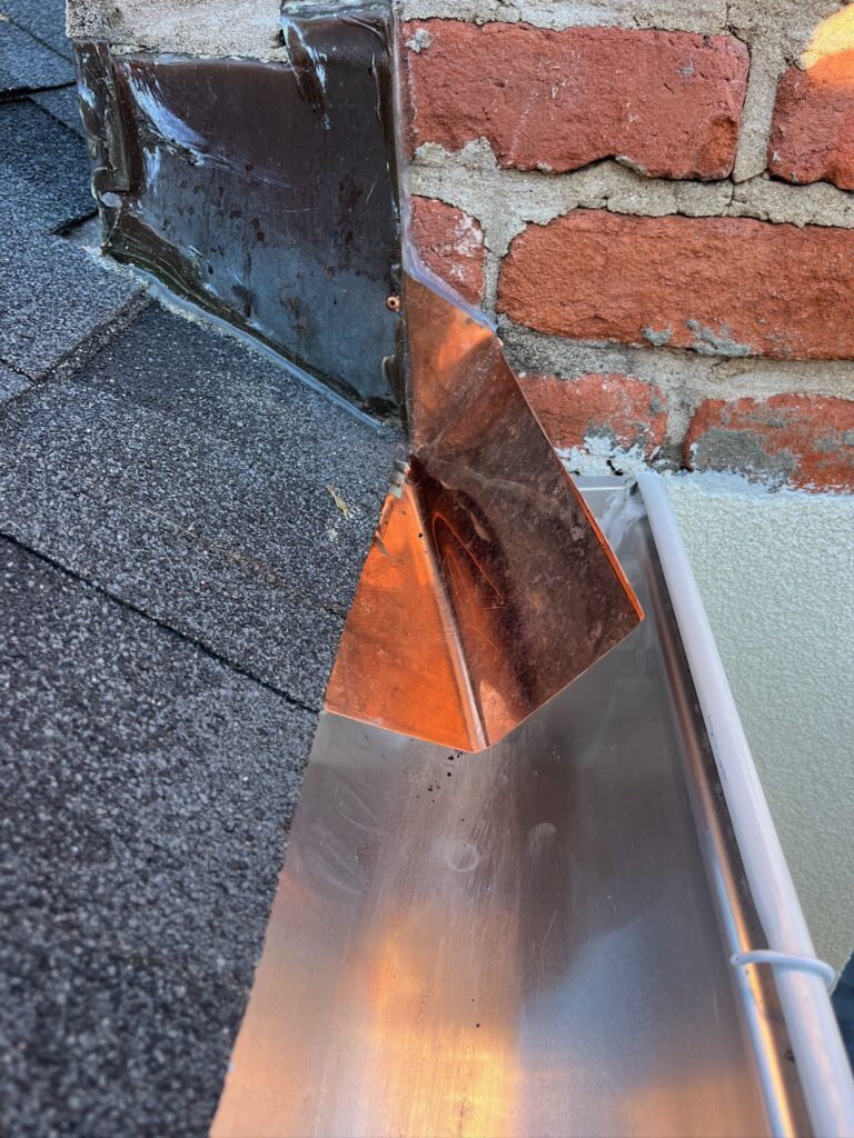 Original Photo- Close up of Brick Chimney Flashing -Chimney Cap Builders