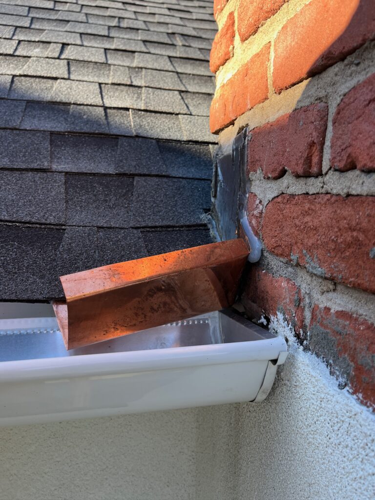 Original Photo- Close up of Brick Chimney on Roof -Chimney Cap Builders