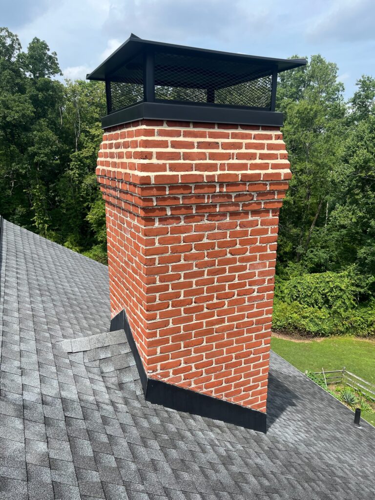 Original Photo- Large Black Chimney Cap on Roof-Chimney Cap Builders