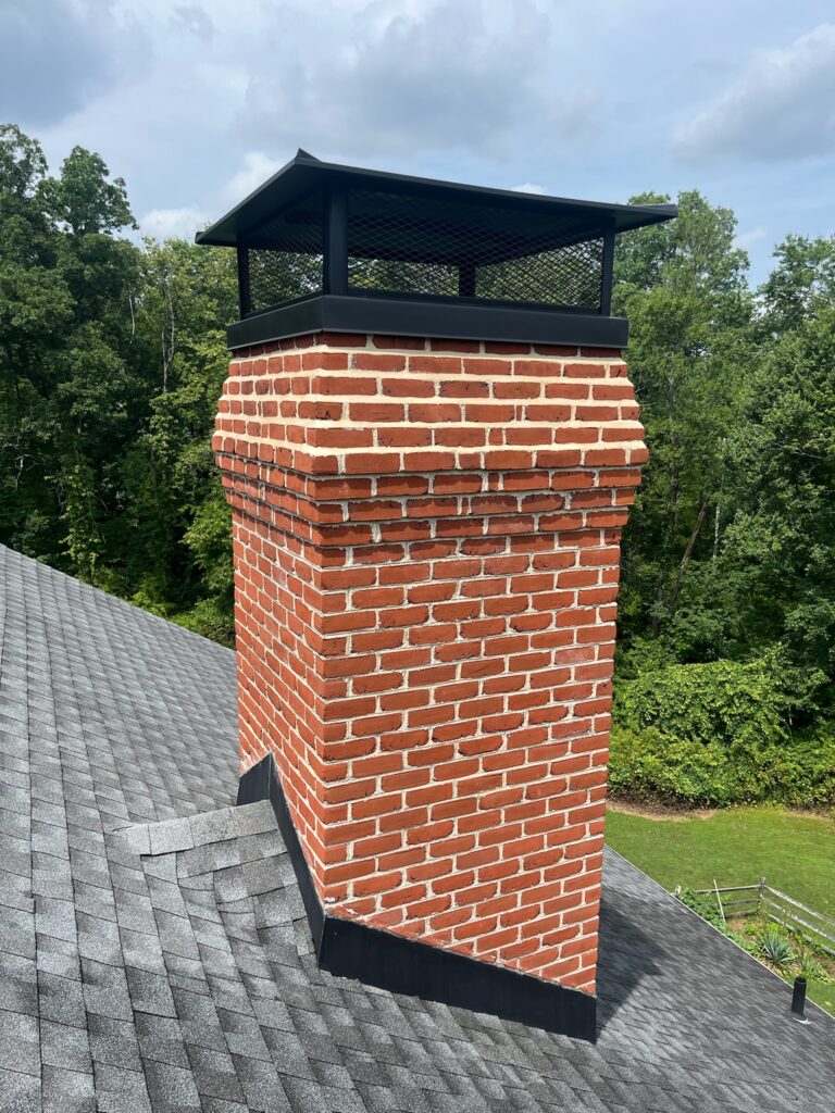 Original Photo- Black Chimney Cap on Roof-Chimney Cap Builders