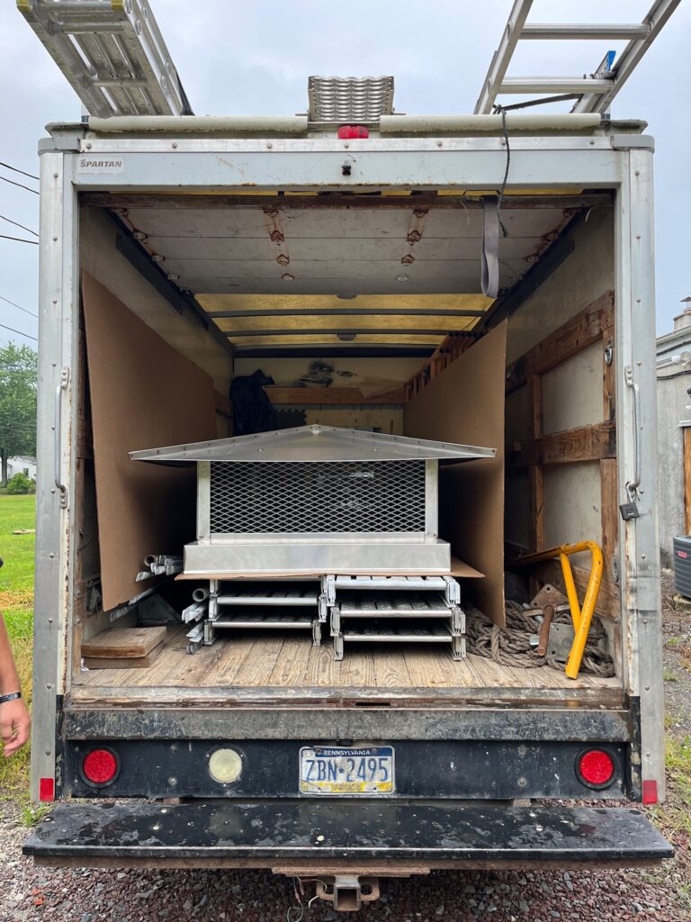 Original Photo- Steel Chimney Cap in Truck-Chimney Cap Builders