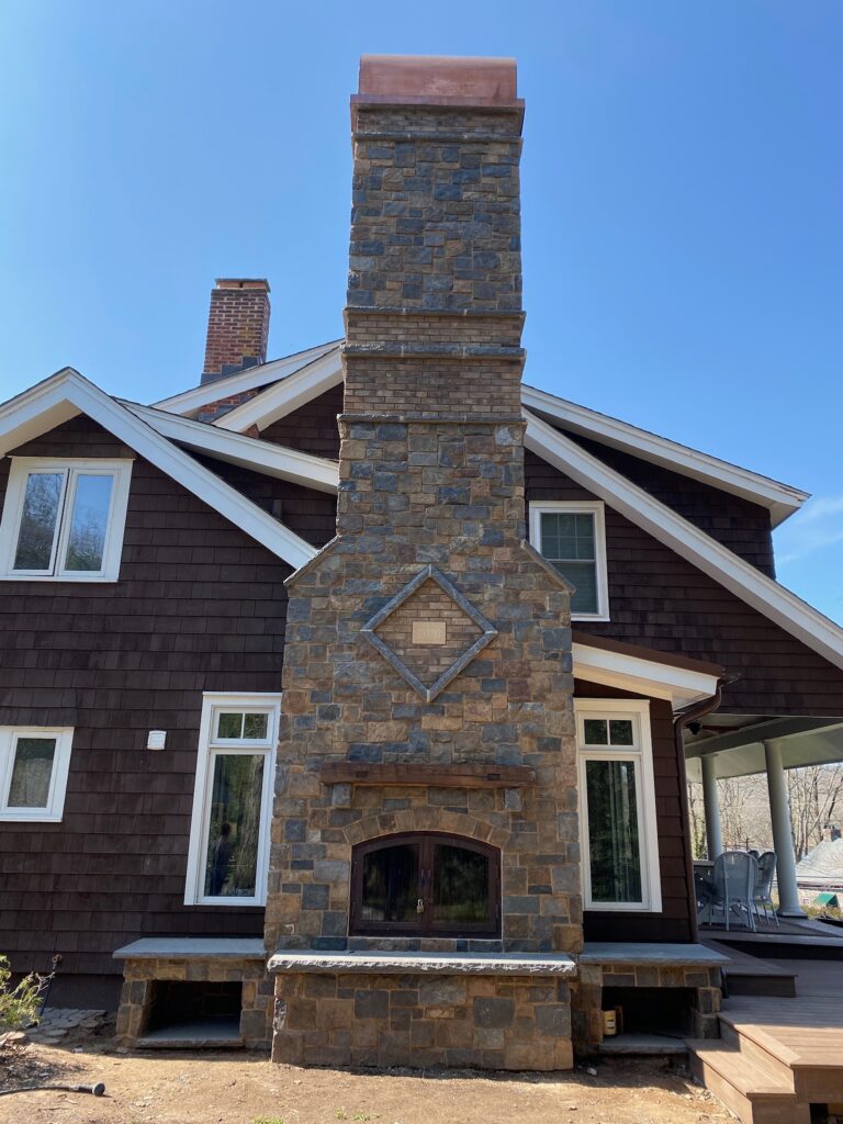 Original Photo- Large Brick Chimney With Cap-Chimney Cap Builders