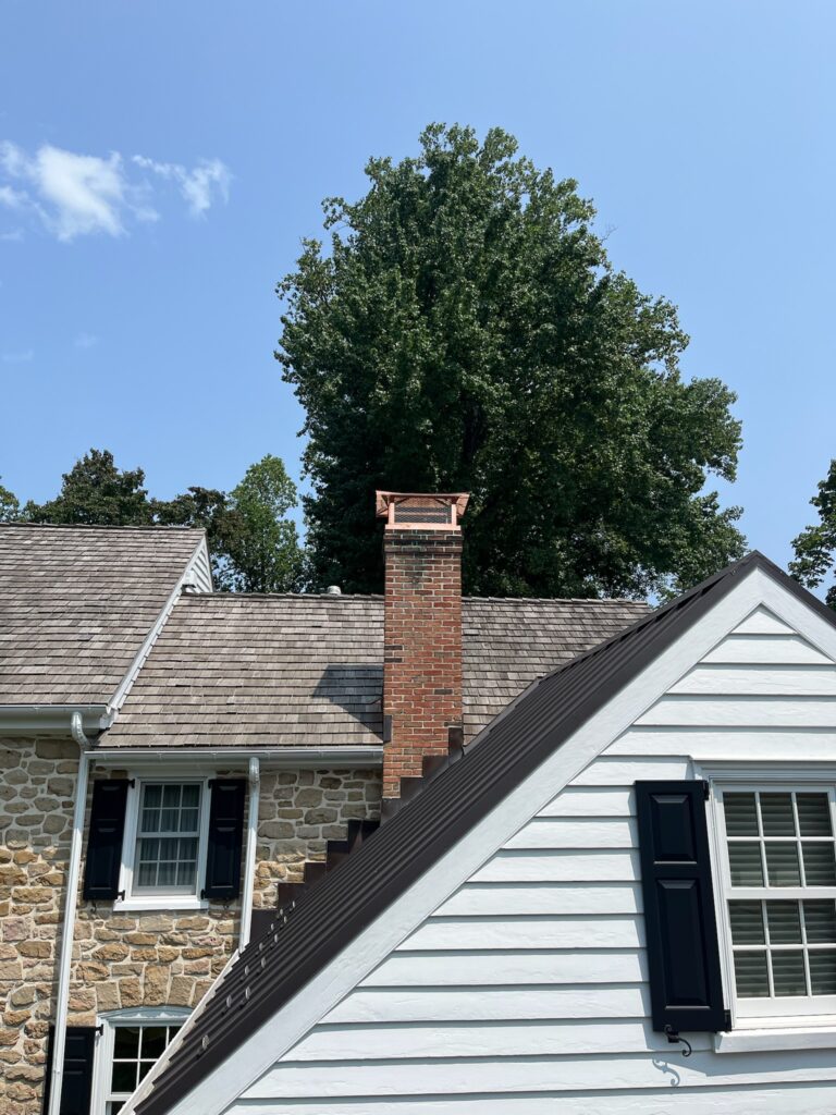 Close up Of Bronze Chimney Cap on Roof