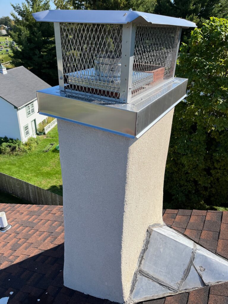 Original Photo- Steel Chimney Cap on Roof-Chimney Cap Builders