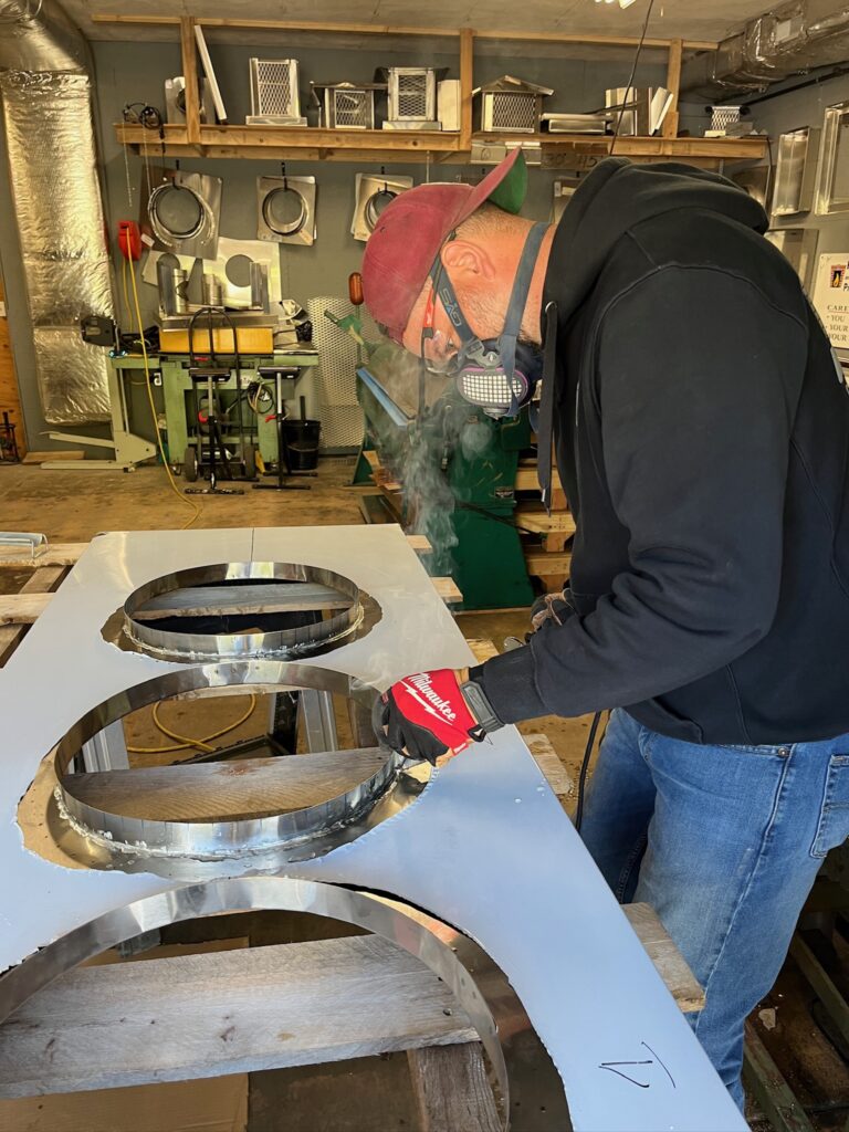 Technician Building Custom Chimney Cap