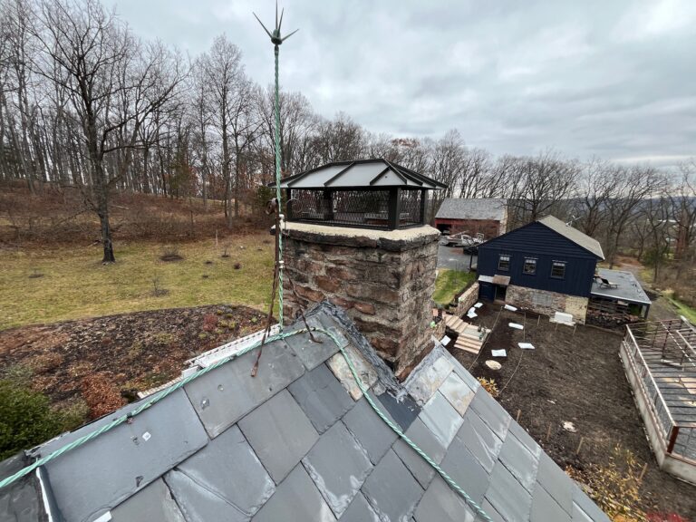 Original Photo- Black Brick Chimney Cap on Roof-Chimney Cap Builders